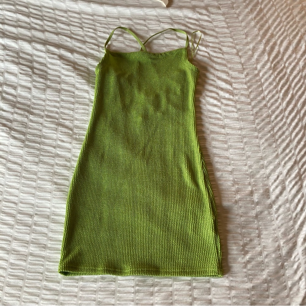 Green mini strappy back tight fit dress from Urban Outfitters